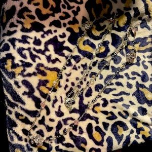 Long silver necklace with pink and white stones